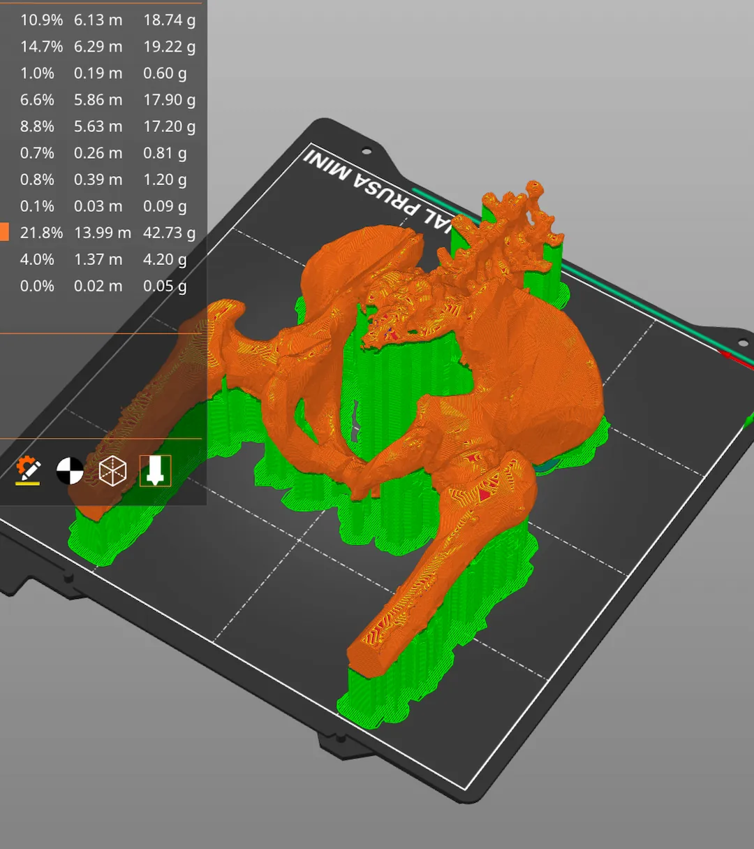 A screenshot of a pelvis which has been exported straight from Invisaid and imported into Prusa Slicer. The pelvis is shown in a 3D view with various support structures added to it to aid with the 3D printing process.